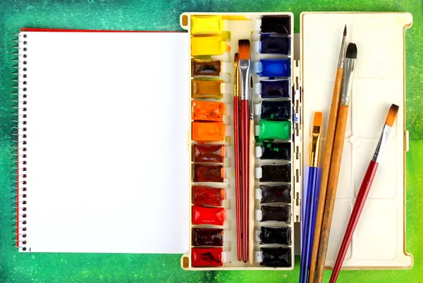 Watercolor paints with brushes — Stock Photo, Image