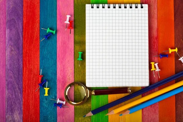 Notebook na barevném pozadí — Stock fotografie