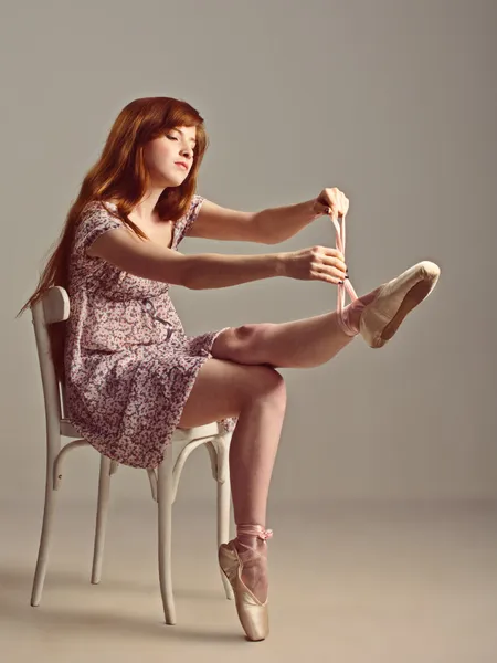 stock image Redhead girl trying on pointe shoes