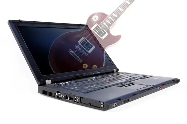 Modern laptop and electric guitar — Stock Photo, Image