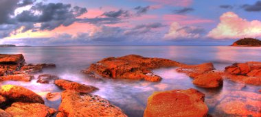 Sea stones at sunset - Sydney Australia clipart