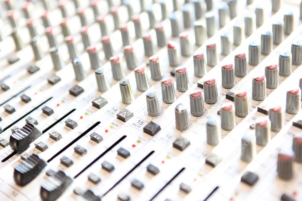 Audio mixing console closeup - music concept, studio shot