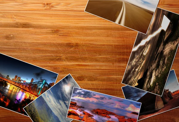 Фотографии на деревянном столе — стоковое фото