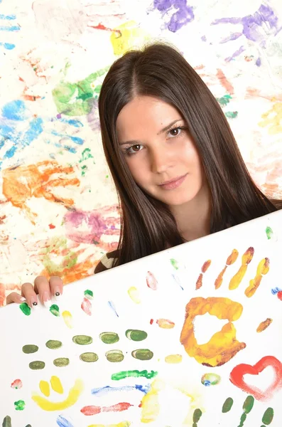 Chica con la mano pintada en pinturas de colores listos para las impresiones de mano —  Fotos de Stock