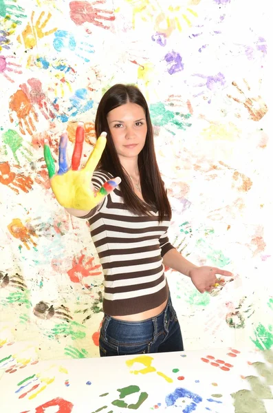 Girl with hand painted in colorful paints ready for hand prints — Stock Photo, Image