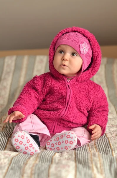 Portret van schattige baby in roze jurk — Stockfoto