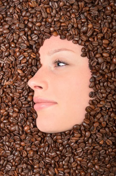 Woman and coffee beans — Stock Photo, Image