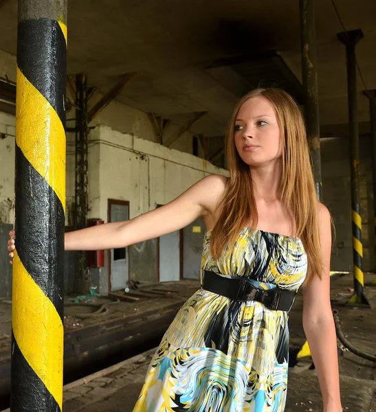Young woman in old factory — Stock Photo, Image