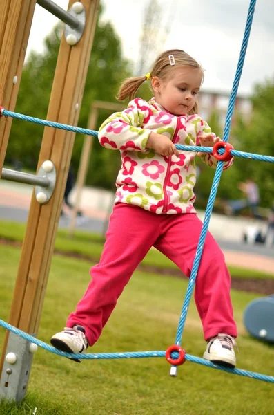 Cute little baby at the swing — Stock Photo, Image