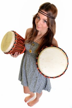 Pretty girl playing the drums or tom toms with her hands clipart