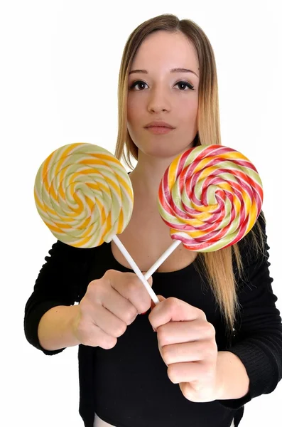 Bella ragazza guarda su lolipop — Foto Stock