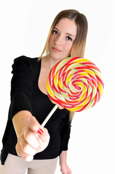 Nice girl looks on lolipop — Stock Photo, Image