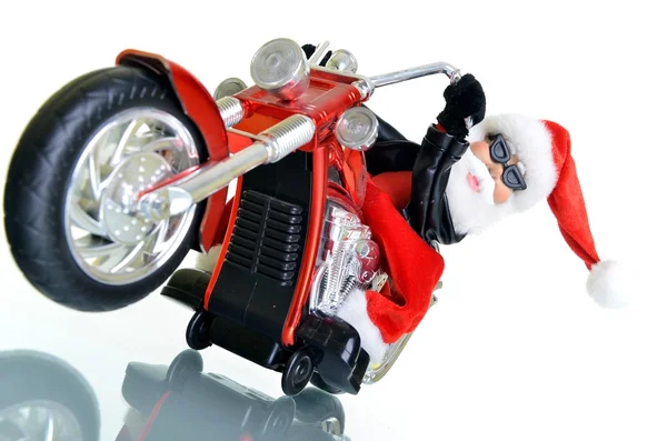 Santa claus stojící na motorce na bílém pozadí — Stock fotografie