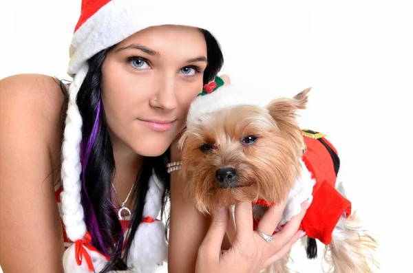 Pretty girl and dog in santa hat at Christmas — Stock Photo, Image
