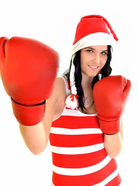 サンタ帽子クリスマスの女性が身に着けている手袋をボクシングを祝う. — ストック写真