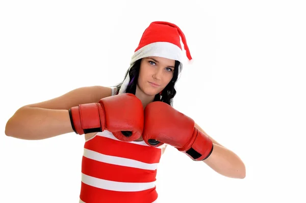 Santa hat vánoční žena slaví nosí Boxerské rukavice. — Stock fotografie