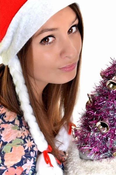 Жінка Різдво молода красива посміхається з капелюхом Санти — стокове фото