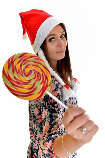 Kvinnan jul unga vackra leende med santa's hat — Stockfoto