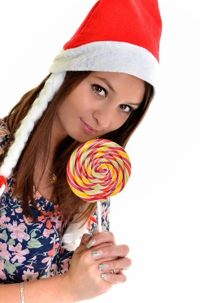 Kvinnan jul unga vackra leende med santa's hat — Stockfoto