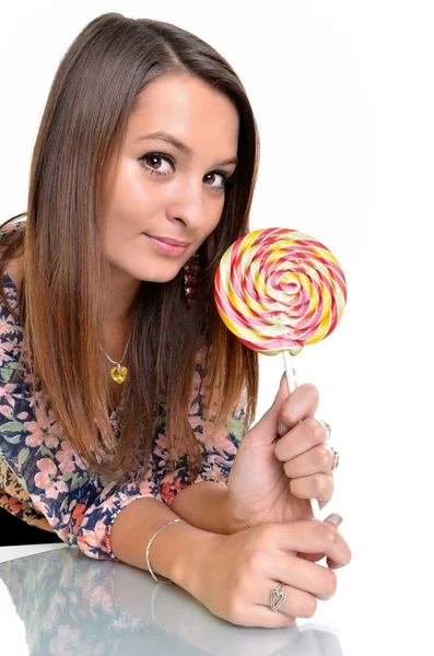 Sexy jonge brunette vrouw met een lolly — Stockfoto