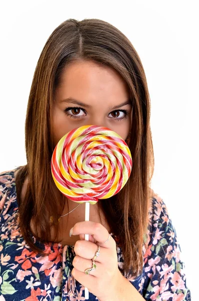 Sexy young brunette woman with a lollipop — Stock Photo, Image
