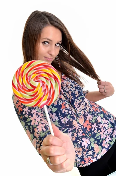 Sexy jonge brunette vrouw met een lolly — Stockfoto