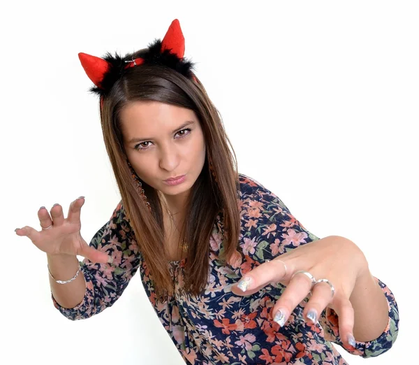 Pretty young girl is wearing a sexy devil costume with a trident, isolated — Stock Photo, Image