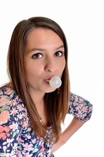 Beautiful girl making a bubble from chewing gum — Stock Photo, Image