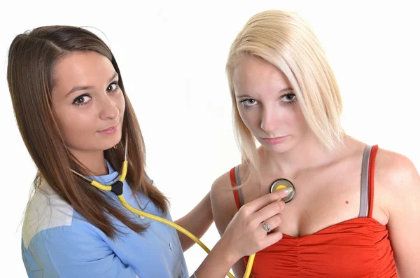 Female doctor and patient islolated on white Royalty Free Stock Photos