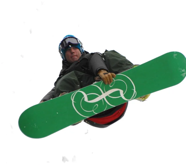 धूप के दिन ऊंचे पहाड़ों में कूदने पर स्नोबोर्डर . — स्टॉक फ़ोटो, इमेज
