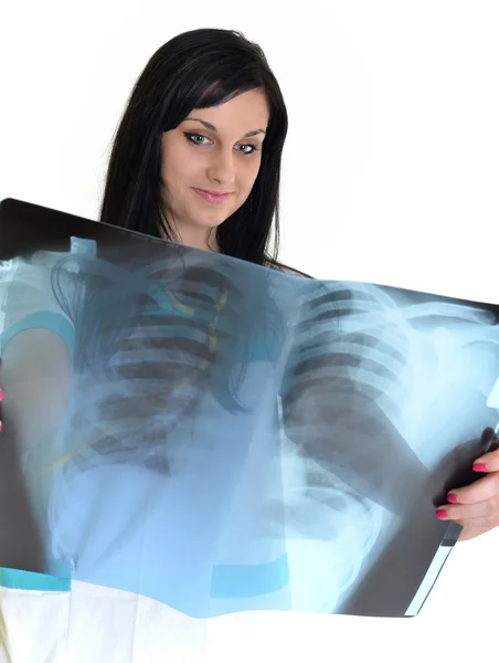 Een vrouwelijke arts is het controleren van x-ray-geïsoleerd op witte achtergrond — Stockfoto