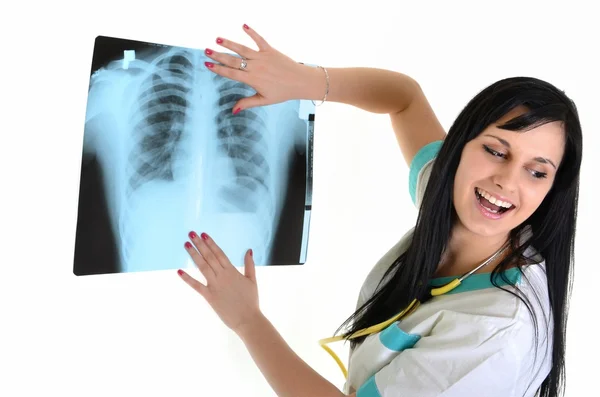 Uma médica feminina está verificando raio-x - isolado em fundo branco Imagens Royalty-Free
