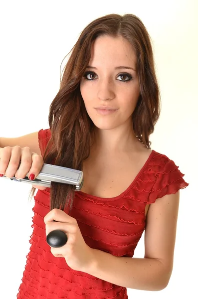 Retrato de jovem menina bonita fazendo penteado — Fotografia de Stock
