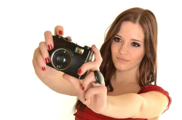 Mulher com câmera sobre fundo branco — Fotografia de Stock