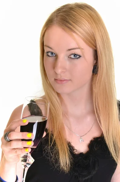 Studio portrait of a beautiful young woman with a glass of red win — Stock Photo, Image