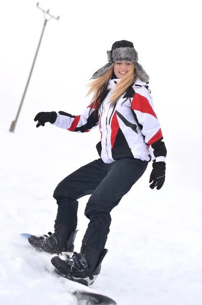 Snowboarding woman — Stock Photo, Image