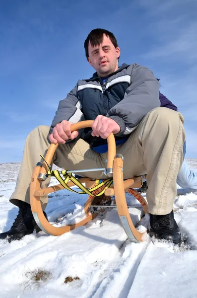 stock image Man with down syndrome sledding