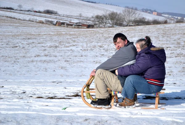 stock image Down syndrome couple sledding