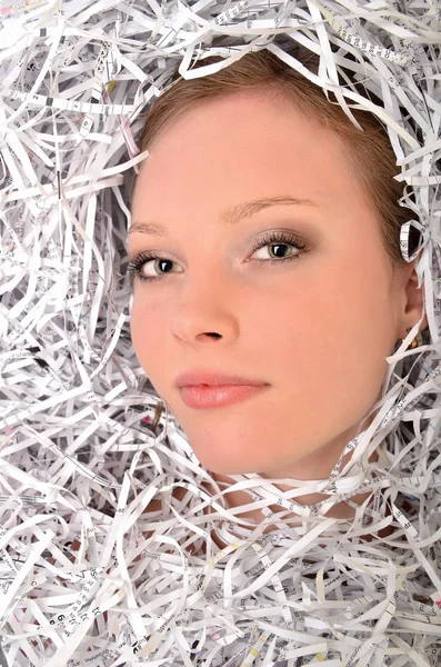 Joven empresaria cubierta por papeles triturados — Foto de Stock