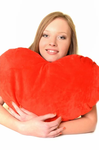 Valentine's Day. Beautiful smiling woman with a gift in the form of he — Stock Photo, Image