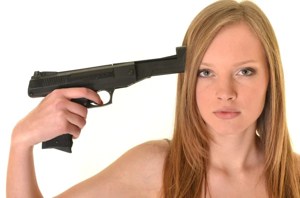Сексуальна жінка з пістолетом ізольована на білому — стокове фото