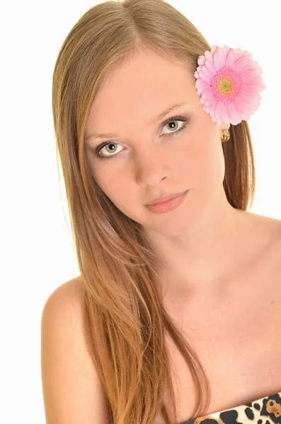 Beautiful young woman with gerber flower isolated on white background — Stock Photo, Image