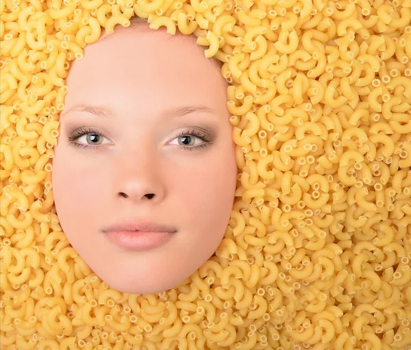 Portrait of a young beautiful woman in pasta — Stock Photo, Image