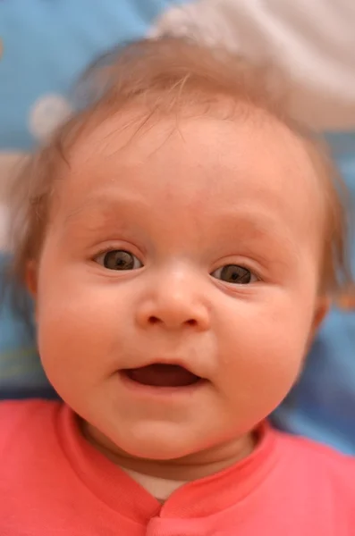 Portrait of baby with crazy expression on his face — Stock Photo, Image