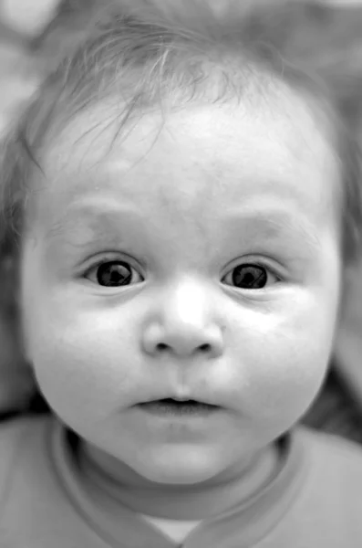 Portrait of baby with crazy expression on his face — Stock Photo, Image