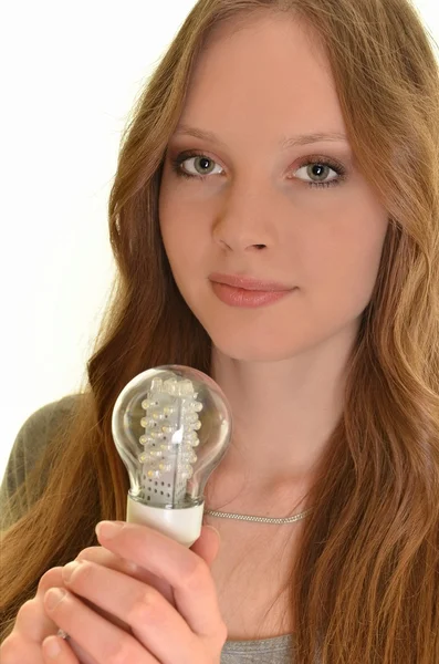Donna con lampadina a diodi isolata su bianco — Foto Stock