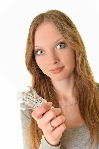 Bright picture of woman holding energy saving bulb — Stock Photo, Image