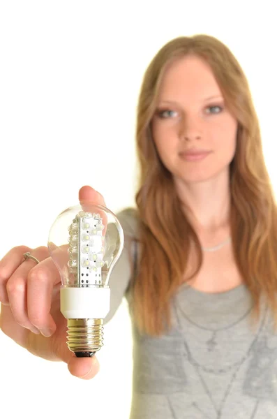 Femme sexy avec ampoule à diode isolée sur blanc — Photo