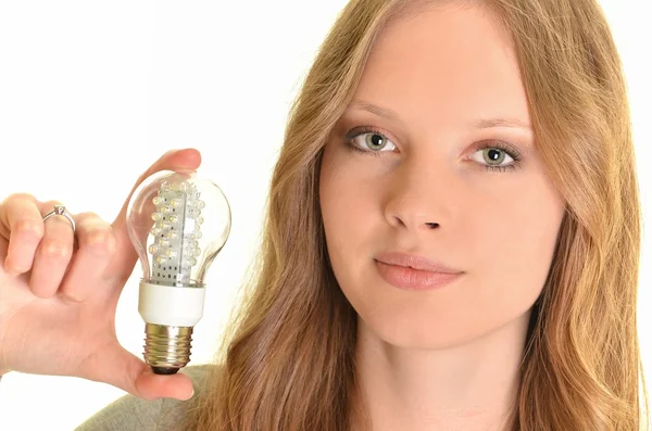 Sexig kvinna med diod lampa isolerad på vit — Stockfoto
