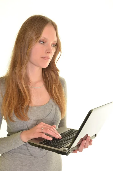 Donna con computer portatile in mani isolate su bianco — Foto Stock